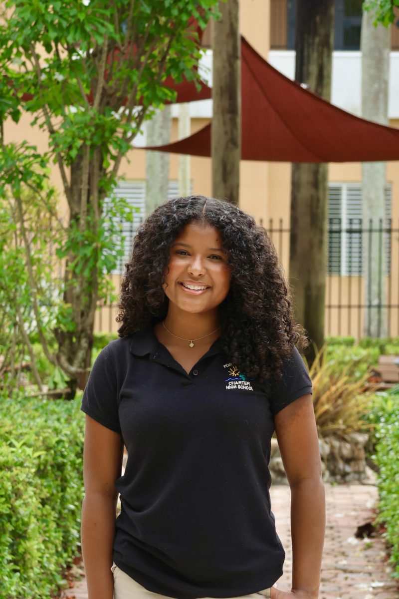 Sophomore Nia Moreno smiling at the camera for her CHAT staff picture.