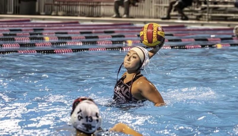 Senior Caitlin Capiro uses power and force to throw the ball into the goal to help her team's lead advance.