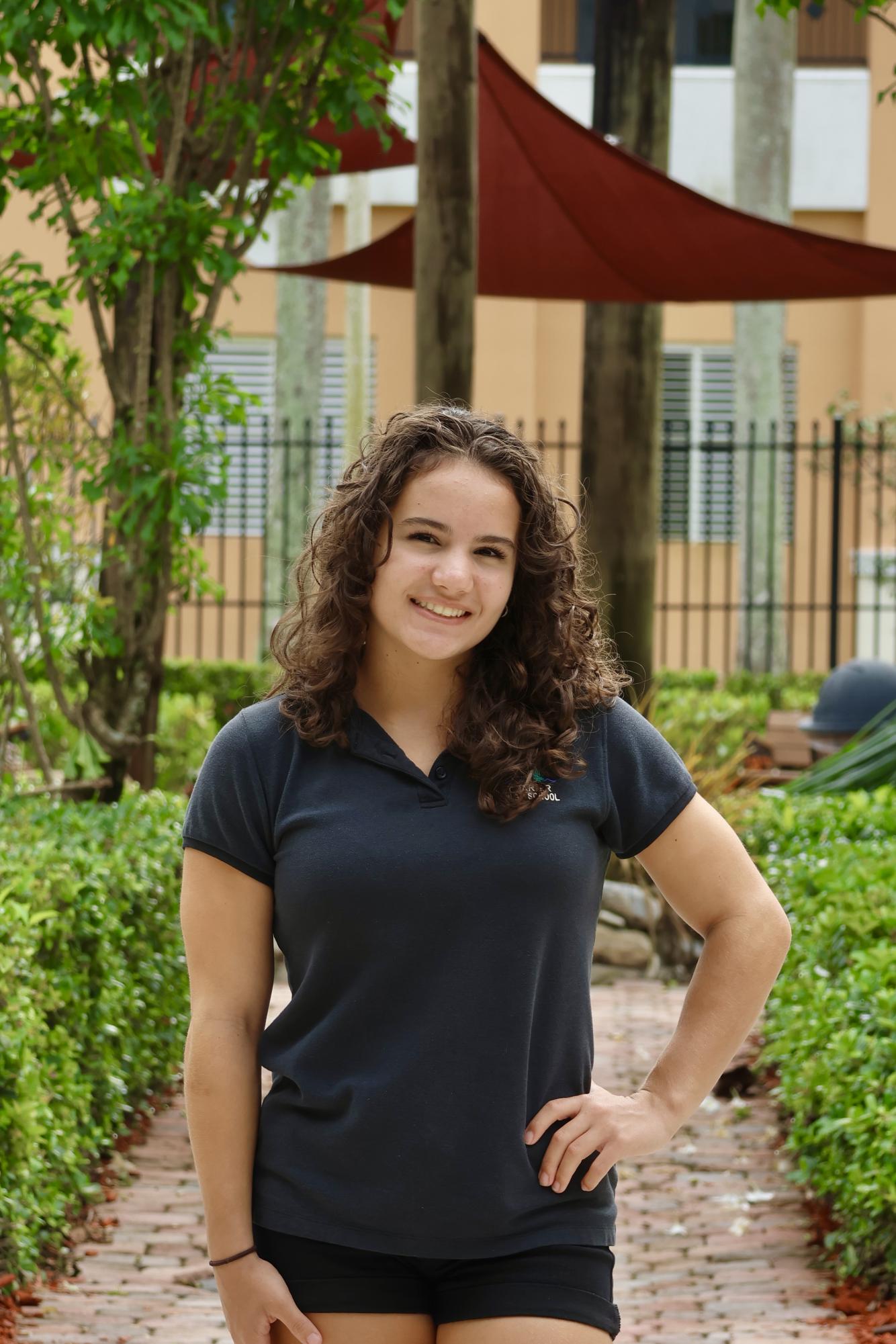 Senior Amanda Quintela smiling at the camera for her CHAT staff picture.