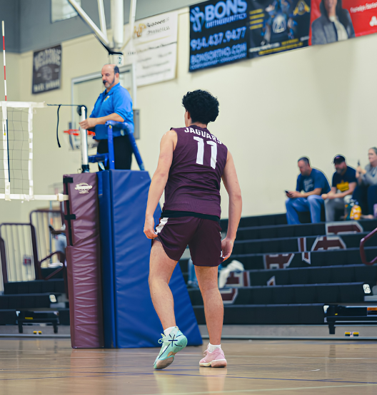 Senior Gerald Cabrera (#11) waiting for the volleyball to be served in his last game at home during his high school career.