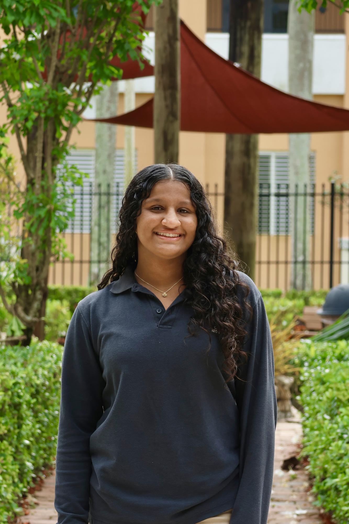 Senior Areeba Haq smiling at the camera for her CHAT staff picture.