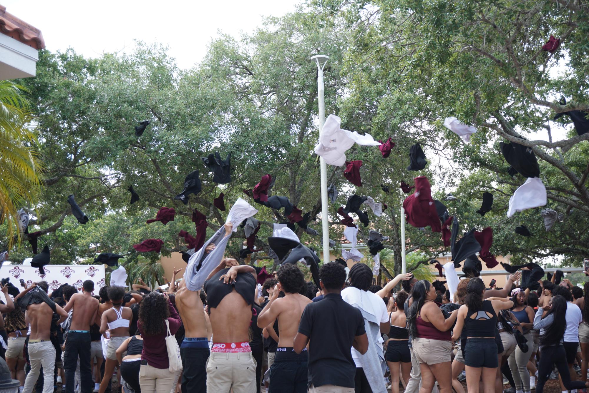 Seniors throw their shirts into the trees surrounding the fountain, a decadeslong Charter tradition.
