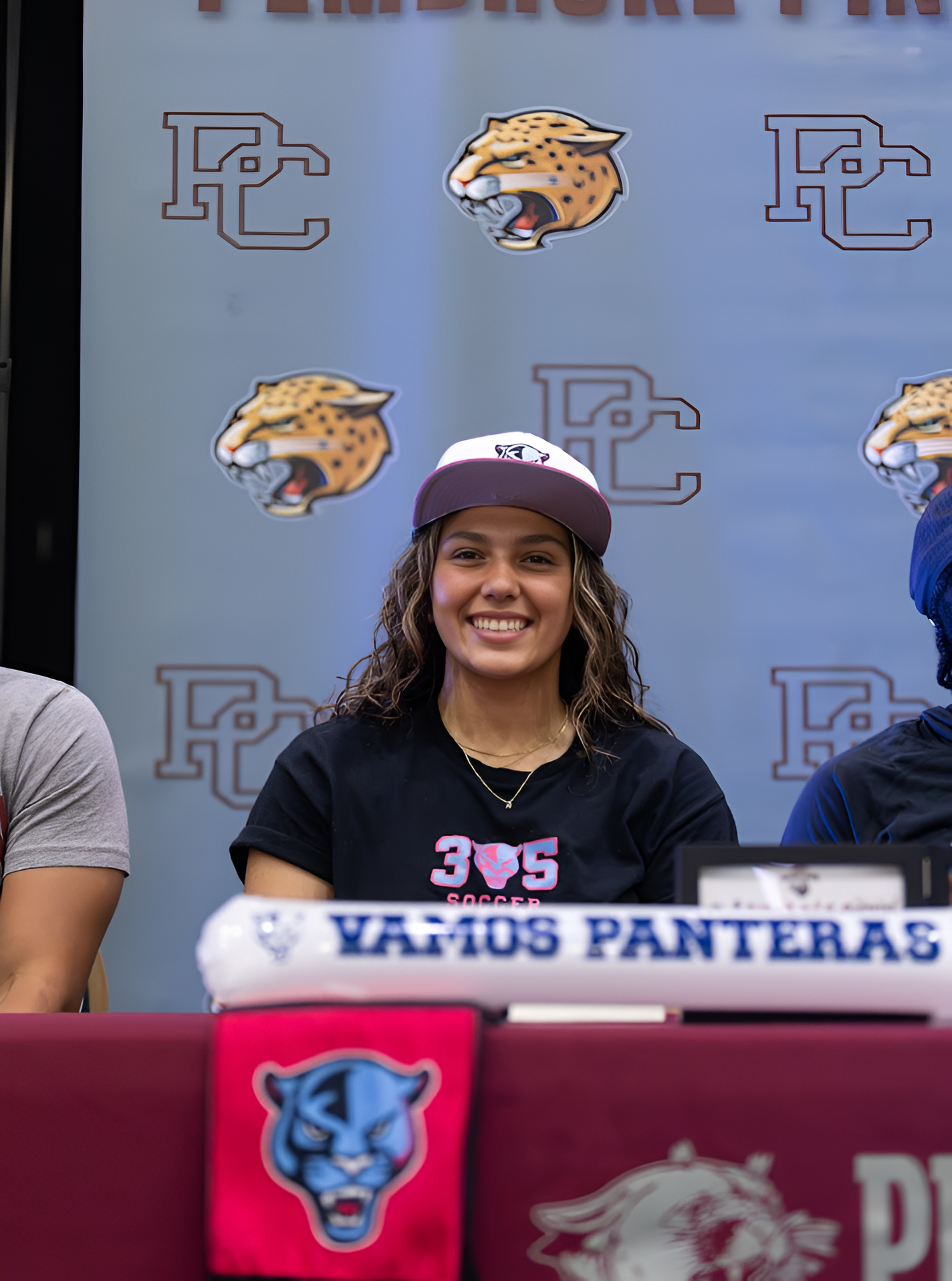 Senior Madison Cassanova smiles at the camera after signing her letter of  intent. 