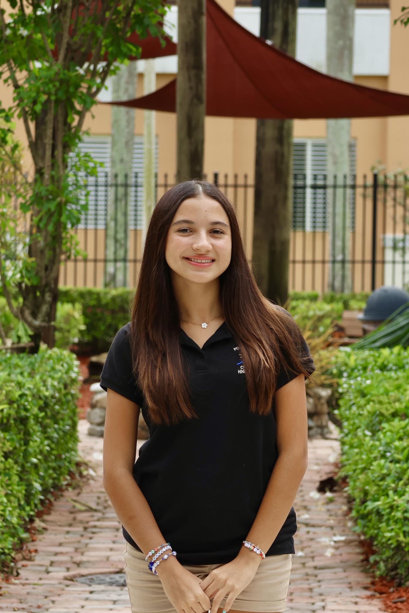 Sophomore Alejandra Gomez Velasquez smiling at the camera for her CHAT staff picture.