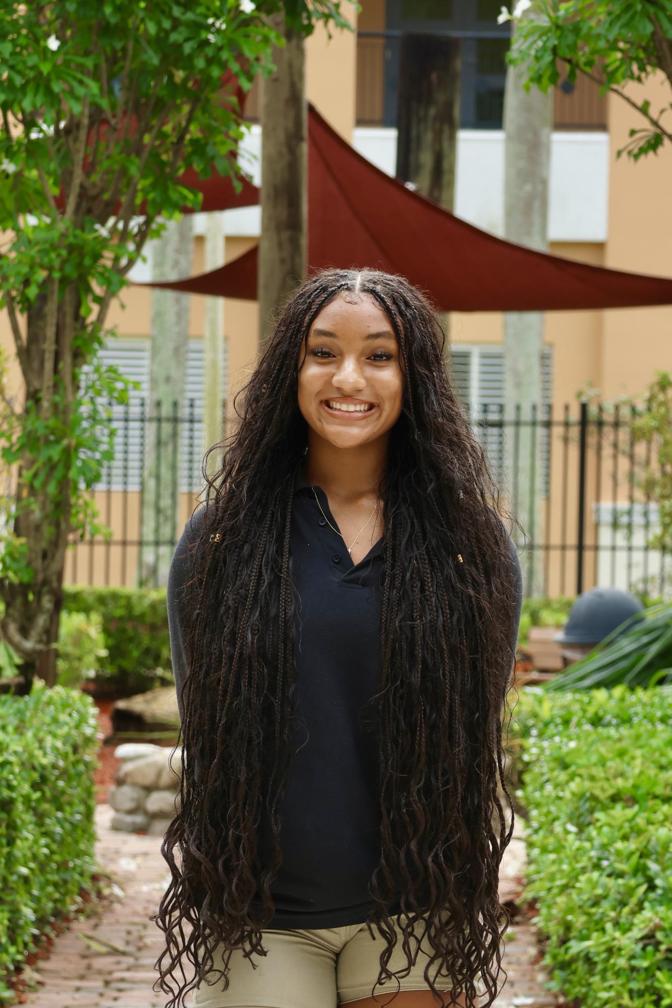 Sophomore Aniya Williams smiling at the camera for her CHAT staff picture.