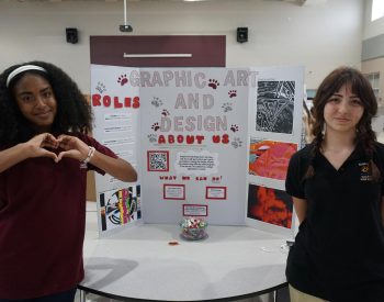 Here are two board members showcasing PPCHS's Graphic Art and Design Club in Club Fair for students who are interested in creating images.