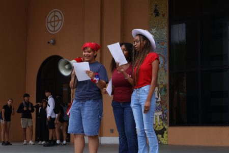 Seniors present at the River of Grass Auditorium. A student (left) wears red and white face paint to celebrate Constitution Day.
Photo by: <a href="https://ppchsnews.com/staff_profile/amaya-jorge/">Amaya Jorge</a>