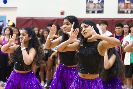 The Bollywood team performs at Pep Rally, clad in glimmering costumes as they impress attendees.