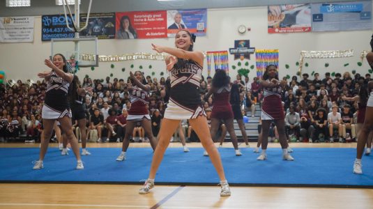 Pines Charter cheerleaders amp up the crowd with their choreographed performances.