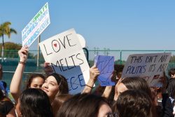 Students wrote catchy slogans on signs protesting against ICE violence in the US.